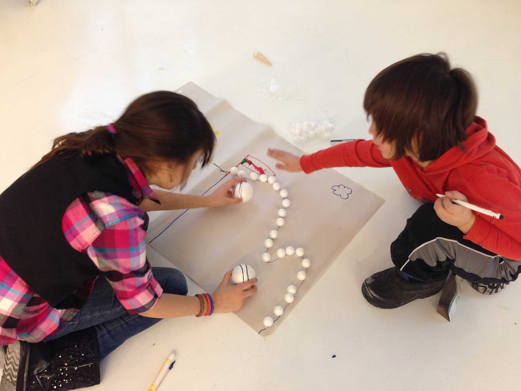 kids create a paper prototype of a game